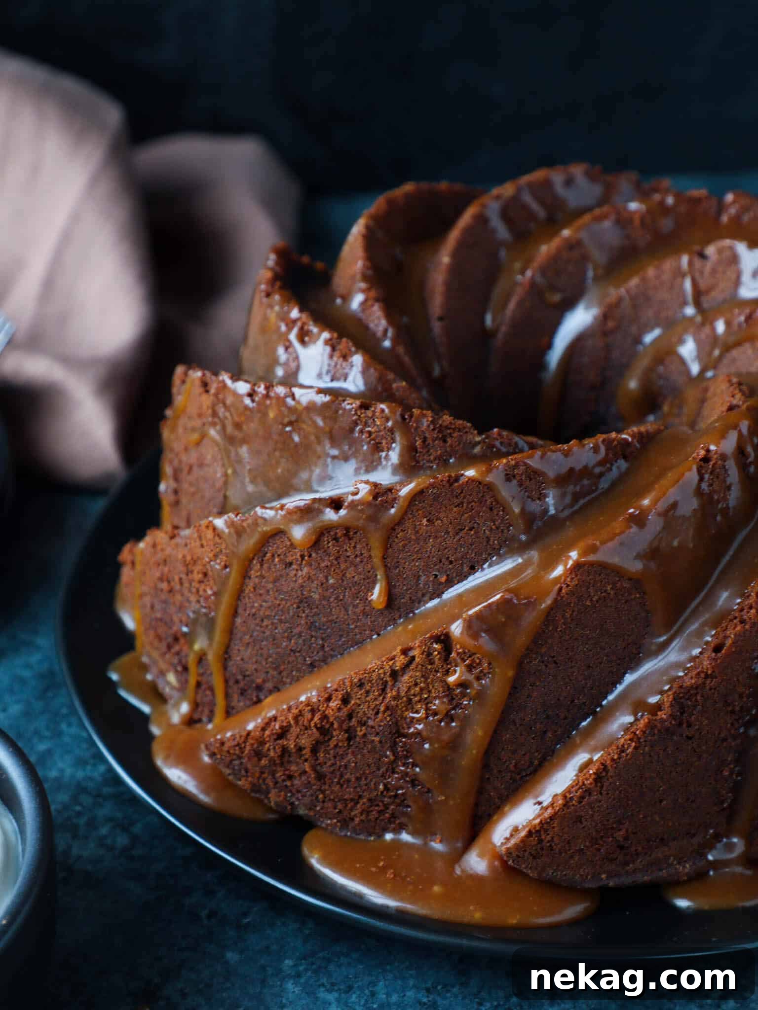 Sticky Caramel Molasses Pound Cake 4 A slice of Caramel Molasses Pound Cake beautifully plated with a generous drizzle of caramel glaze.
