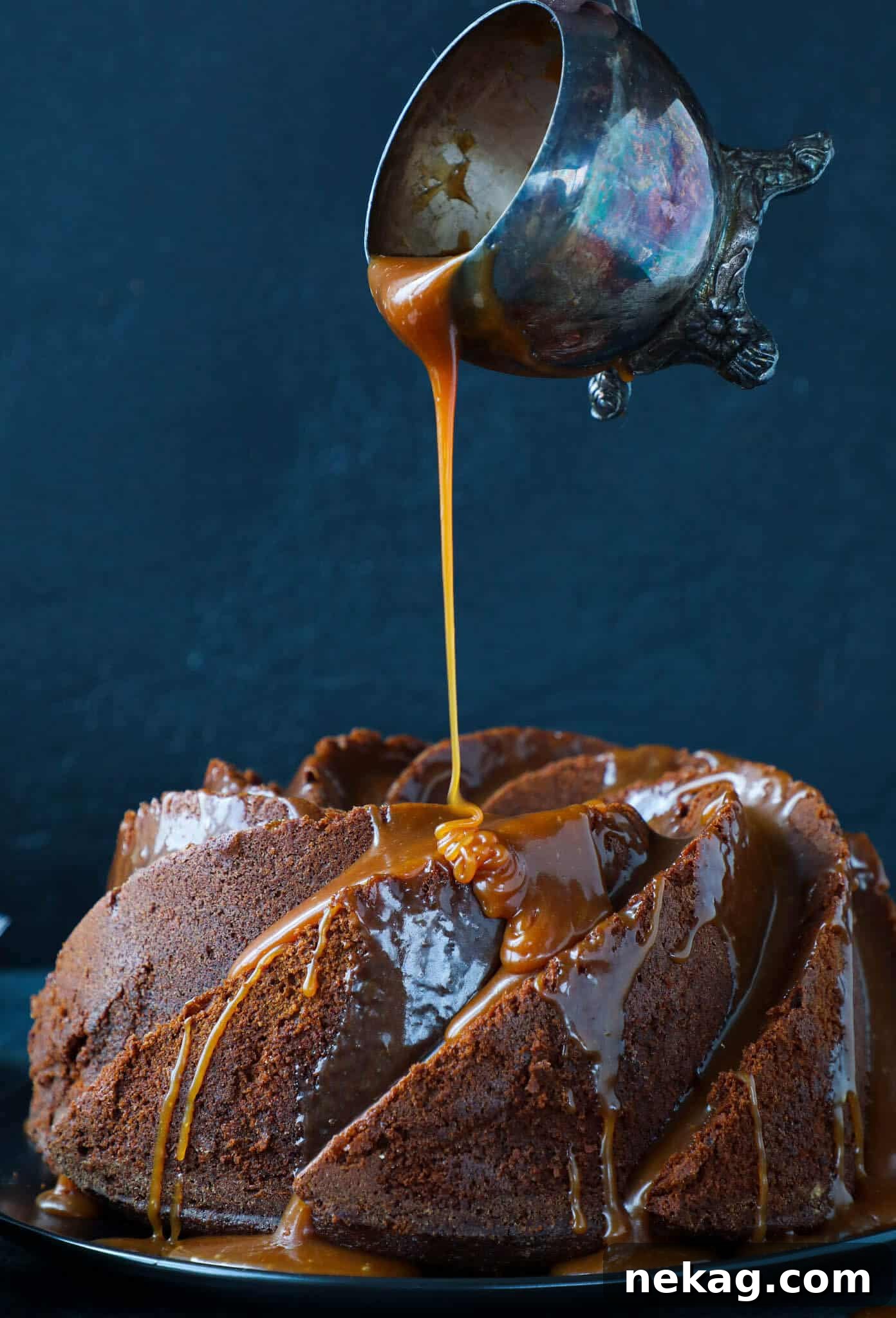 Sticky Caramel Molasses Pound Cake 5 Molasses Pound Cake being glazed with warm salted caramel sauce, showing luscious drips.