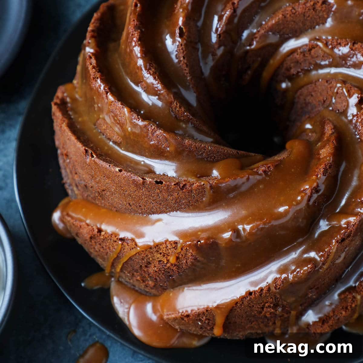 Sticky Caramel Molasses Pound Cake 6 Close-up of a bundt cake, showing intricate details and a rich, dark color.