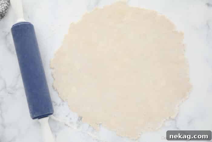 Flaky Butter Pie Crust 13 A perfectly rolled butter pie crust, thin to 1/8-inch and in a round shape, ready for transfer to the pie pan.