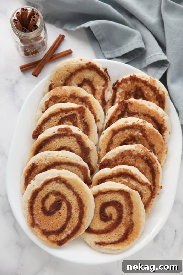 Swirled Cinnamon Pancake Stacks 10 Cinnamon swirl pancakes on a platter.