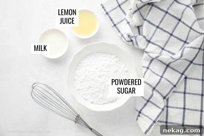 Gooey Blueberry Cinnamon Swirls 13 A clear flat lay showing the simple ingredients for the lemon glaze: a bowl of powdered sugar, a small bowl of fresh lemon juice, and a small container of milk.