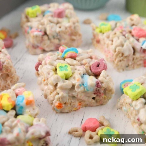 Close-up side view of lucky charms marshmallow treats, showing the layers and texture.