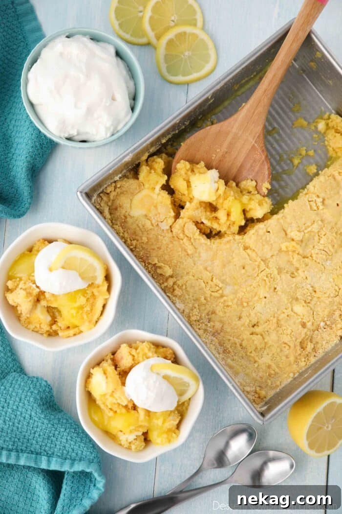 Effortless Lemon Sunshine Cake 3 A freshly baked pan of Lemon Dump Cake, golden and bubbling, alongside two individual servings in bowls, ready to be enjoyed. The image captures the inviting warmth and simplicity of this easy dessert.