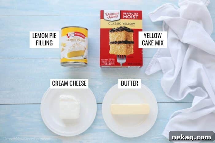 Effortless Lemon Sunshine Cake 5 Four essential ingredients for Lemon Dump Cake clearly labeled: a can of lemon pie filling, a box of yellow cake mix, a block of cream cheese, and a stick of butter, neatly arranged for easy identification.
