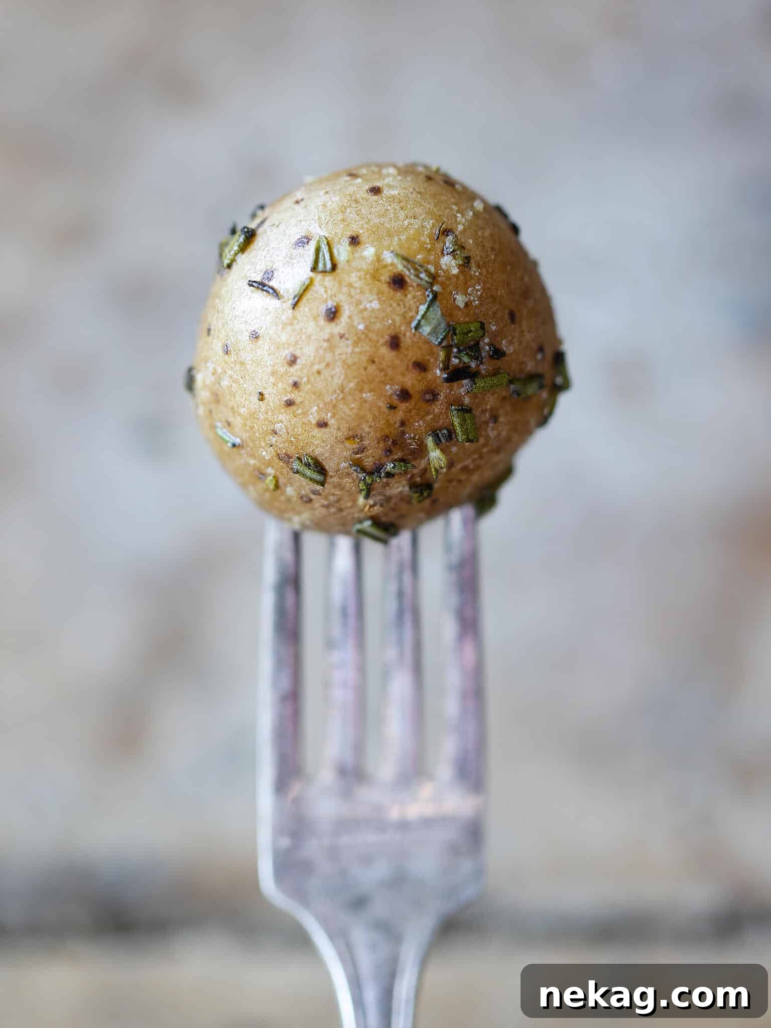 Rosemary Roasted Potato whole on fork