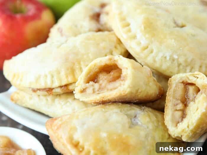 Apple filling inside of a mini pie.