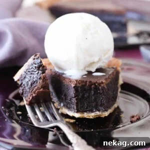 A forkful of easy chocolate pie, showing its rich, dense texture and inviting appearance.