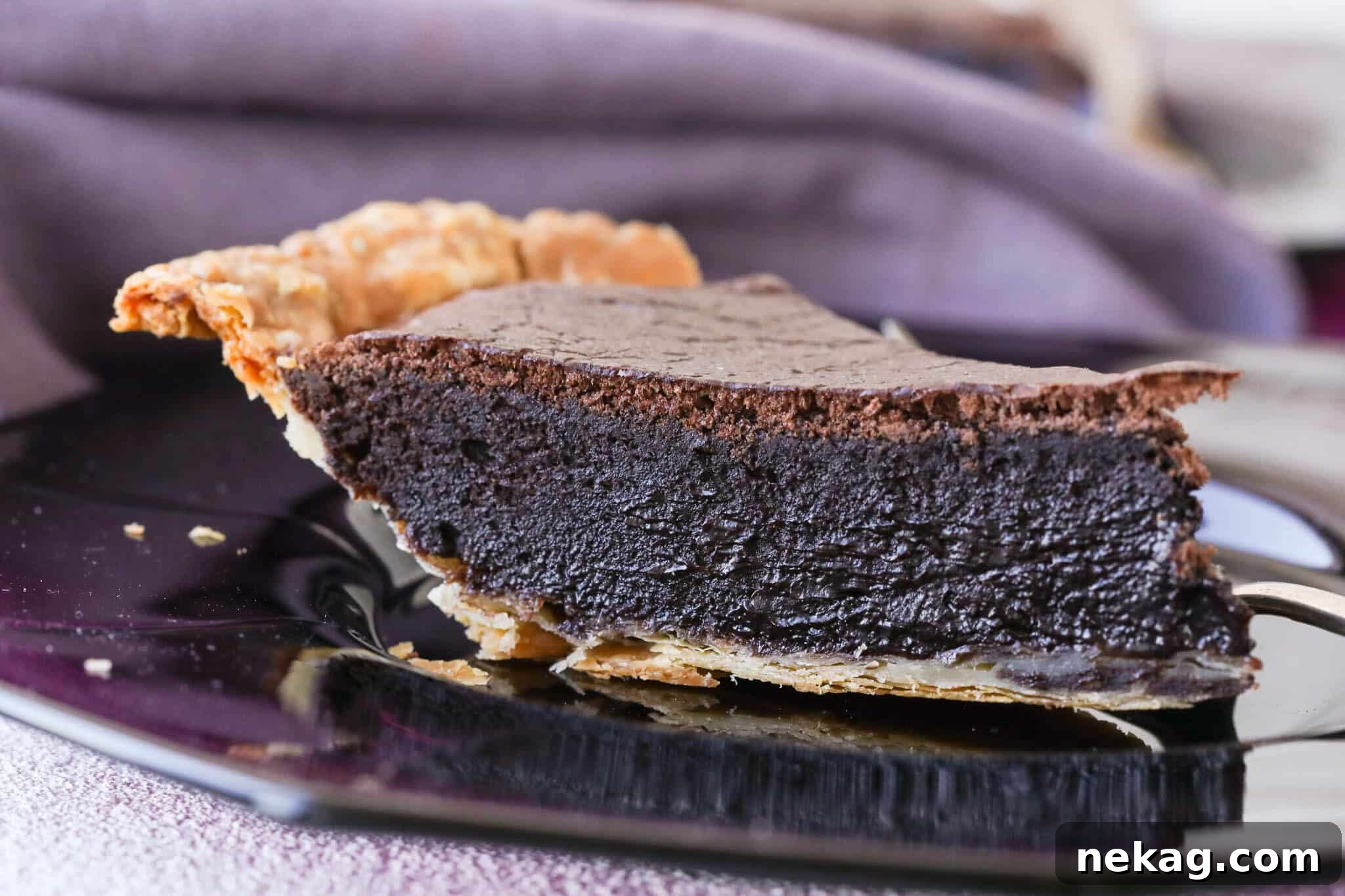 The rich, fudgy interior of a slice of easy chocolate pie, showcasing its dense texture and perfect bake.