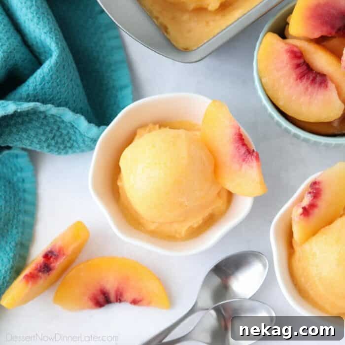 Close-up of instant peach sorbet, showcasing its smooth, soft-serve consistency, freshly blended from frozen peaches.
