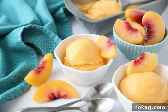 Three individual dishes of peach sorbet, garnished with mint leaves, ready to be served and enjoyed.