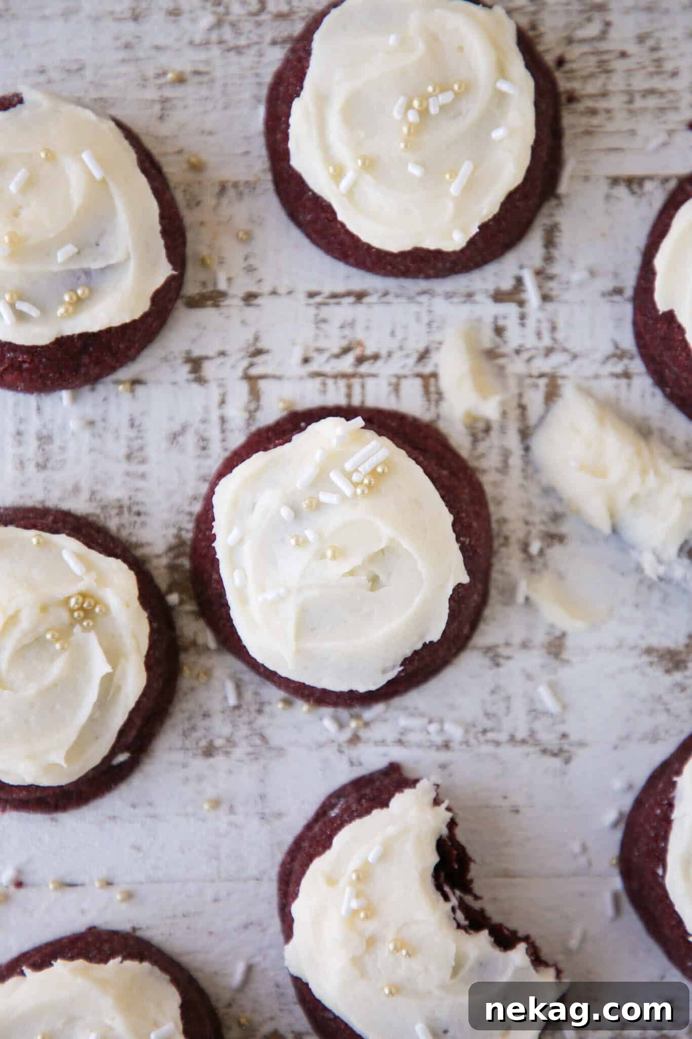 Red velvet cookies grouped elegantly on a beige backdrop, showcasing their perfect texture and color.