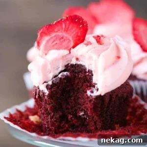 A Red Velvet White Chocolate Cupcake, unwrapped for a close-up view.