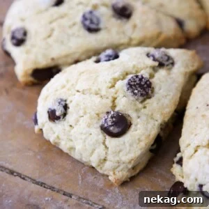 Chocolate chip breakfast pastry beautifully arranged on a wooden board.