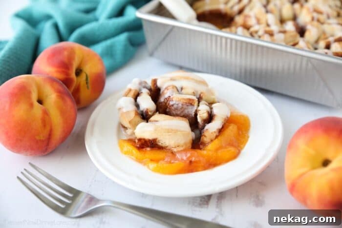 A vibrant display of fresh peach slices, ready for the cobbler, hinting at the delicious filling.