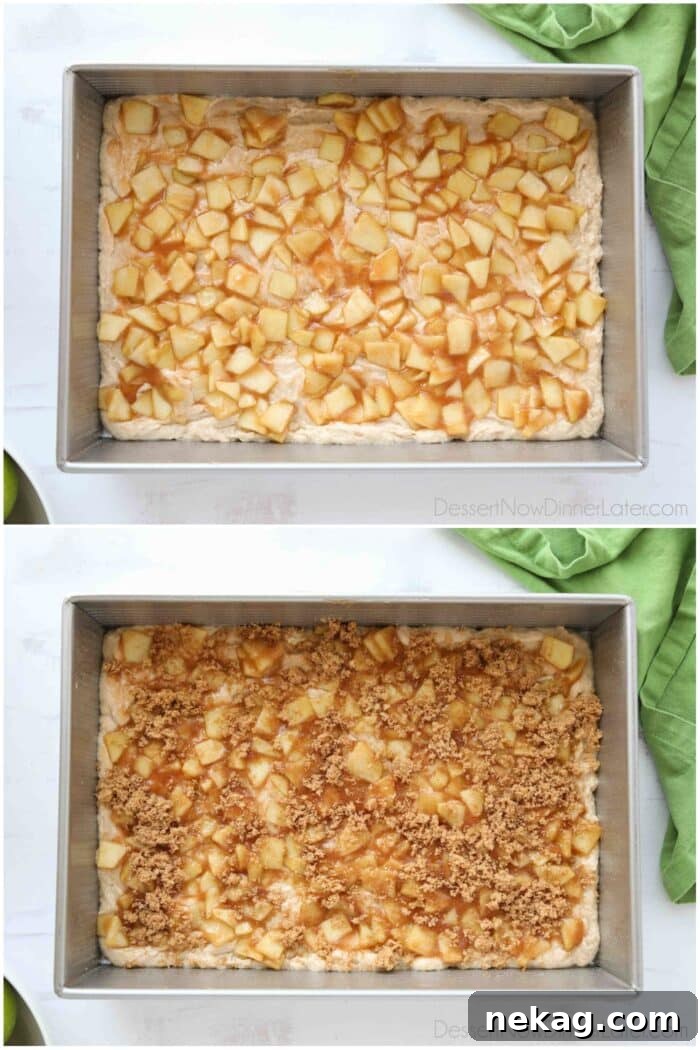 Cinnamon Apple Fritter Cake 7 A close-up view of the assembly process: the first layer of cake batter topped with cooked apples and a generous sprinkle of cinnamon-sugar in a 9x13-inch pan.