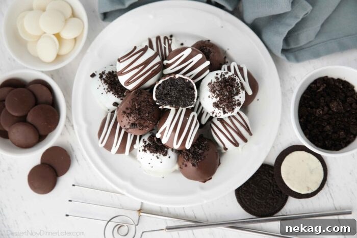 No Bake Oreo Truffles 11 Top-down view of beautifully arranged Oreo Balls on a white plate, showcasing their perfect round shape and chocolate coating.