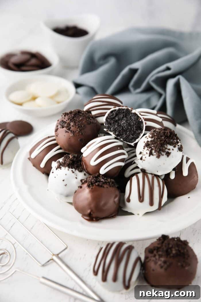 No Bake Oreo Truffles 4 Oreo Truffles on a plate.