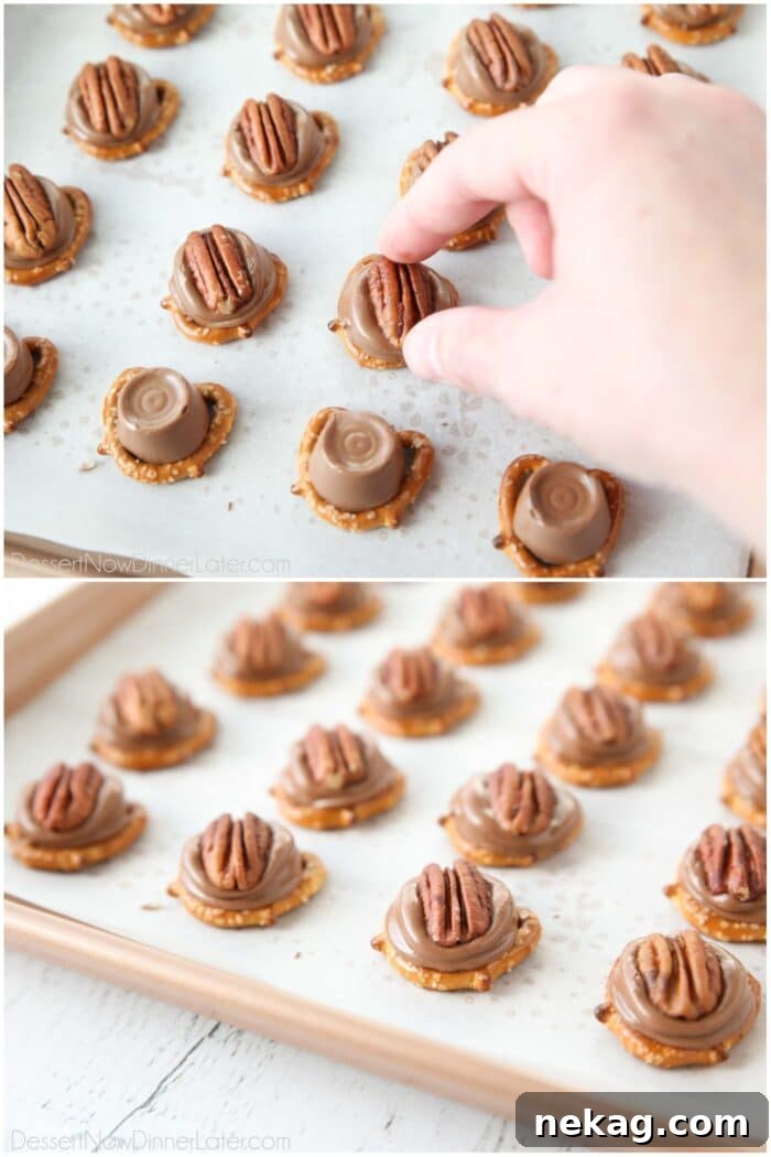 Pecans being pressed into melted Rolo candies on top of pretzels to make Rolo Pretzel Bites.