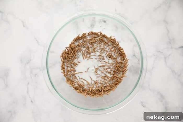 Wholesome Bran Muffins 6 All Bran Cereal being soaked in a bowl with buttermilk.