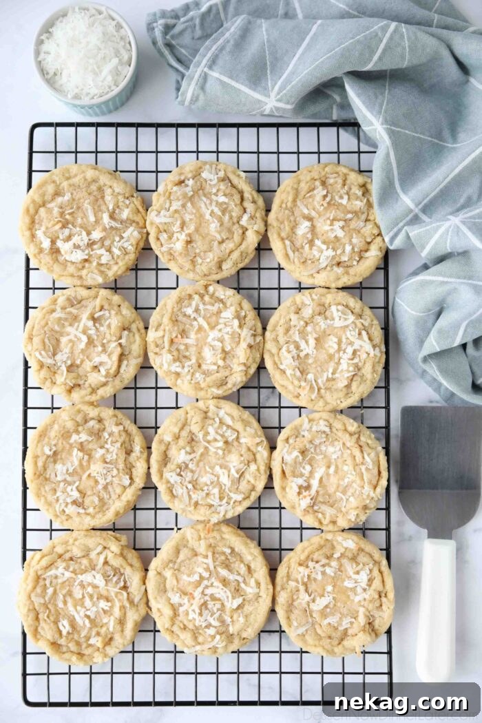 Irresistible Coconut Bites 4 Coconut cookies cooling on a wire rack.