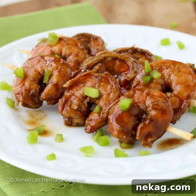 Zesty Grill Brew Prawns 2 Spicy Barbecue Beer Shrimp served on a white plate with skewers