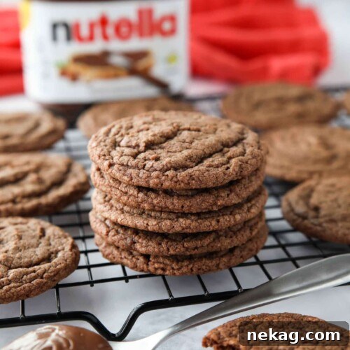 Stack of chocolate Nutella cookies on a wire cooling rack.