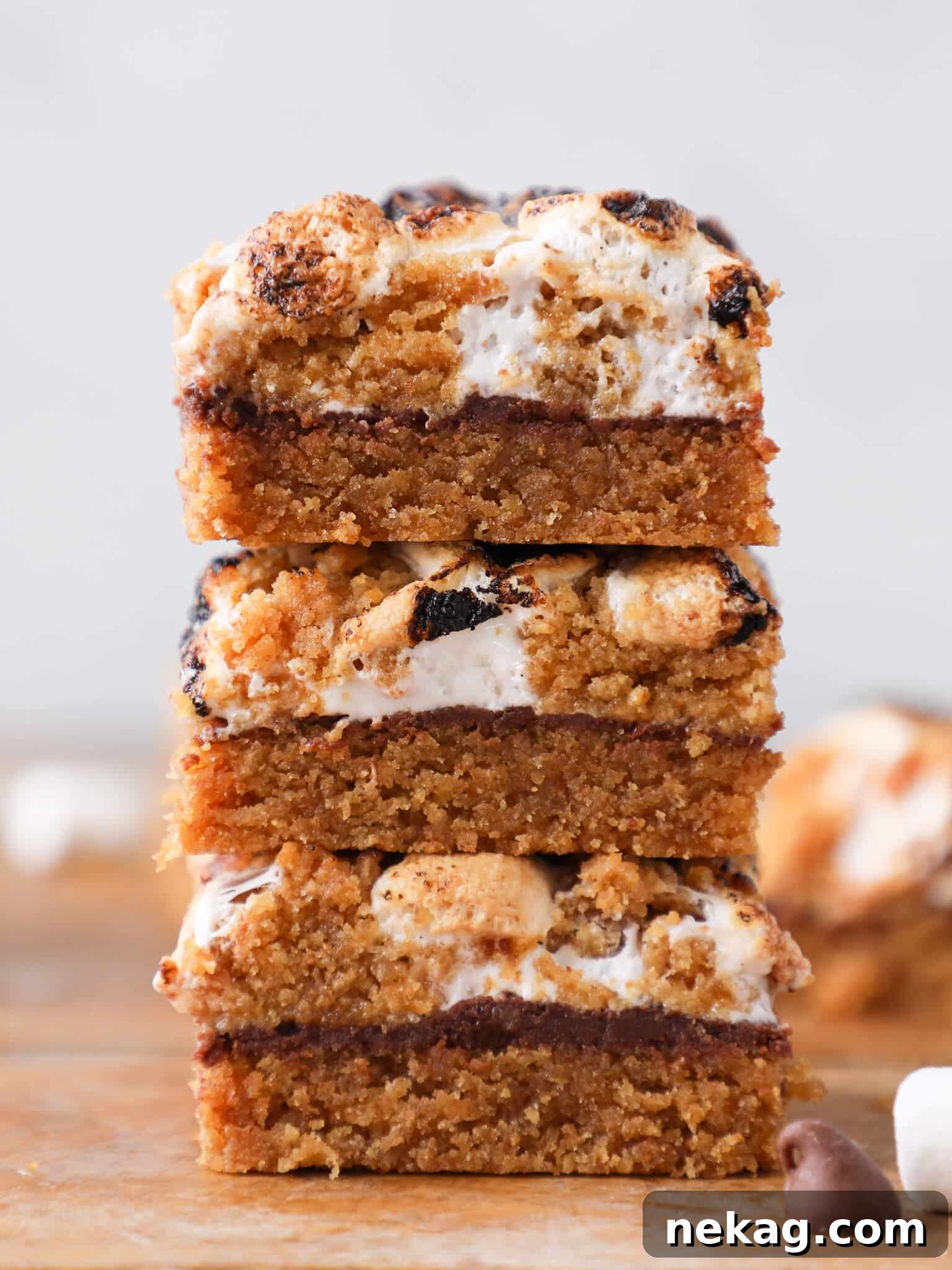 Stacked Soft Chewy S'mores Crumble Bars showcasing their delightful layers