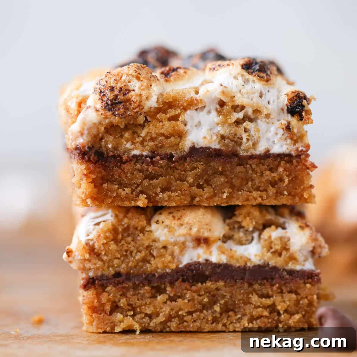 Several Soft Chewy S'mores Crumble Bars sliced and elegantly stacked