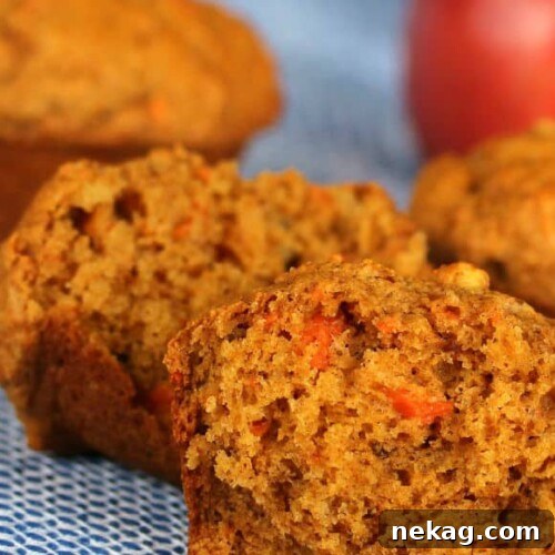 Sunrise Harvest Muffins 4 A plate of freshly baked Morning Glory Muffins, showcasing their wholesome texture and vibrant ingredients.