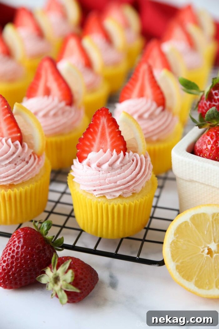 Sunshine Strawberry Lemonade Cupcakes 2 Strawberry Lemonade Cupcakes made from scratch with lemon cake and strawberry frosting.