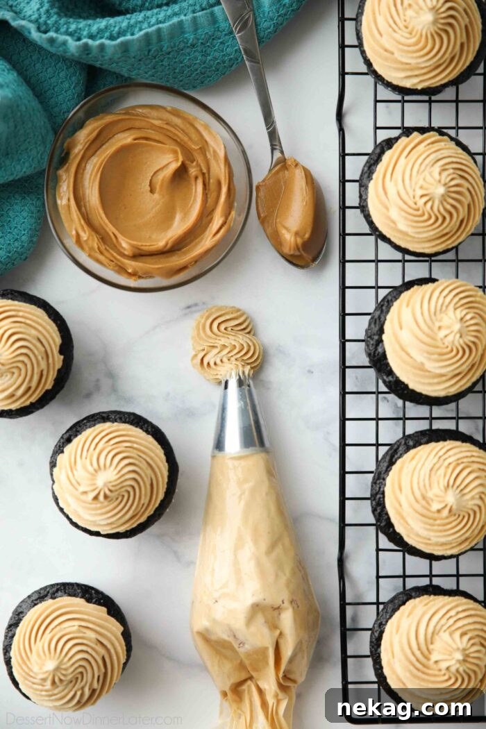 Velvet Peanut Butter Frosting 5 Piping bag of peanut butter frosting with an open star piping tip.