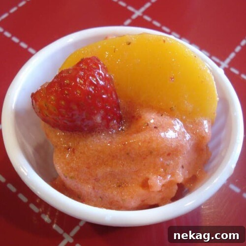 Vibrant Strawberry Peach Sorbet ready to be served in elegant glasses