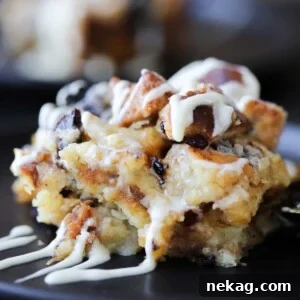 Close-up of a perfectly baked slice of bread pudding, showing its moist interior and golden crust.