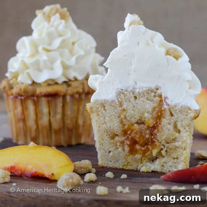 A tray of Peach Crisp Cupcakes, showcasing the inviting combination of cake, compote, streusel, and buttercream