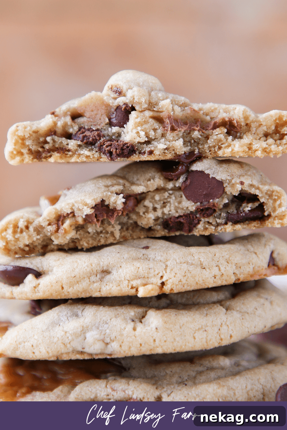 Brown Butter Snickers Caramel Core Chocolate Chip Cookies 8 Caramel Stuffed Brown Butter Snickers Chocolate Chip Cookies with a subtle purple border, highlighting their rich texture.