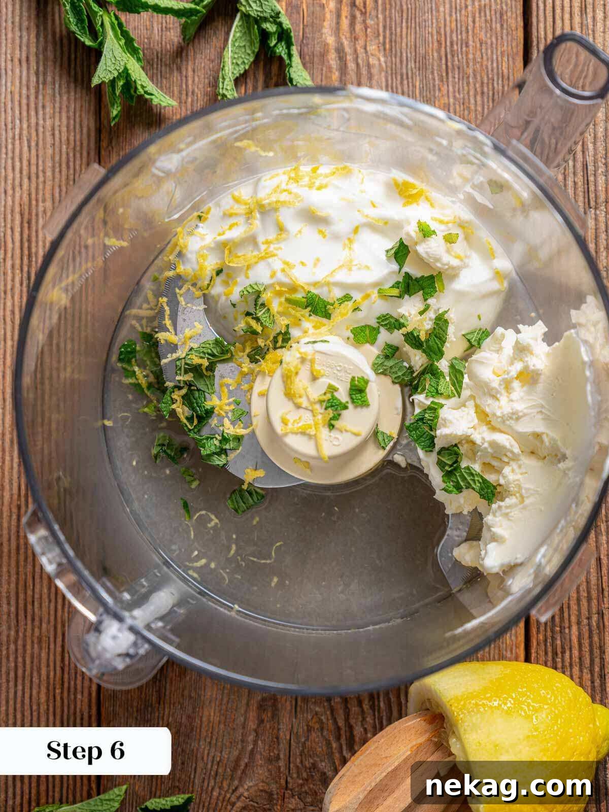 Ultimate Chicken Burgers 9 ingredients for yogurt sauce being blended in a food processor.