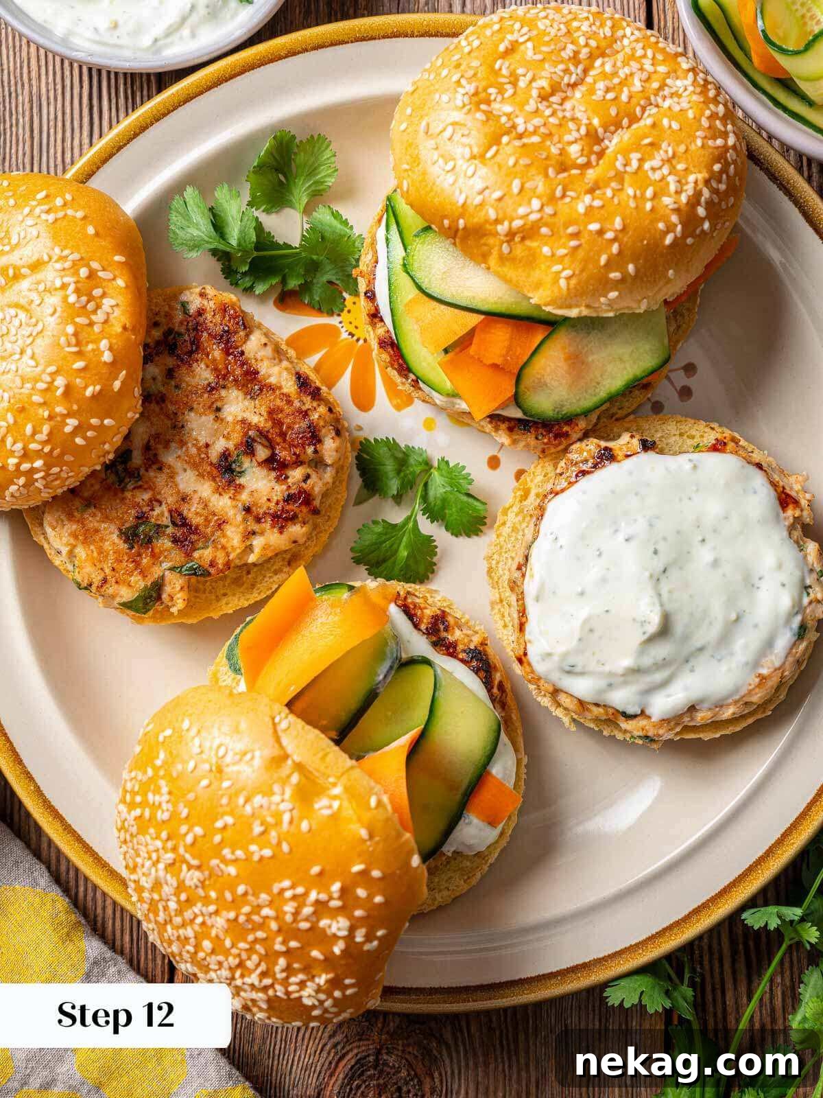 Ultimate Chicken Burgers 10 assembling a perfect chicken burger with all toppings on a plate.