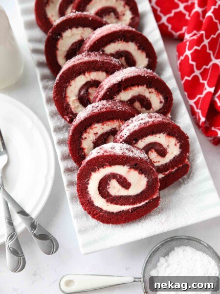 Velvet Chocolate Roulade 9 Rectangular platter with swirls of red velvet cake roll filled with cream cheese frosting.