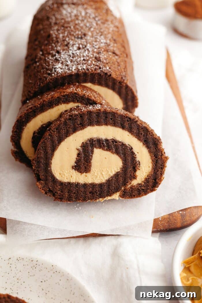 Velvet Chocolate Roulade 5 Slices cut off the end of a chocolate roulade with peanut butter cream cake filling.