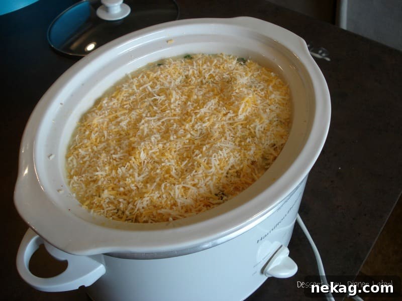 Layering ingredients for Tater Tot Casserole in a baking dish