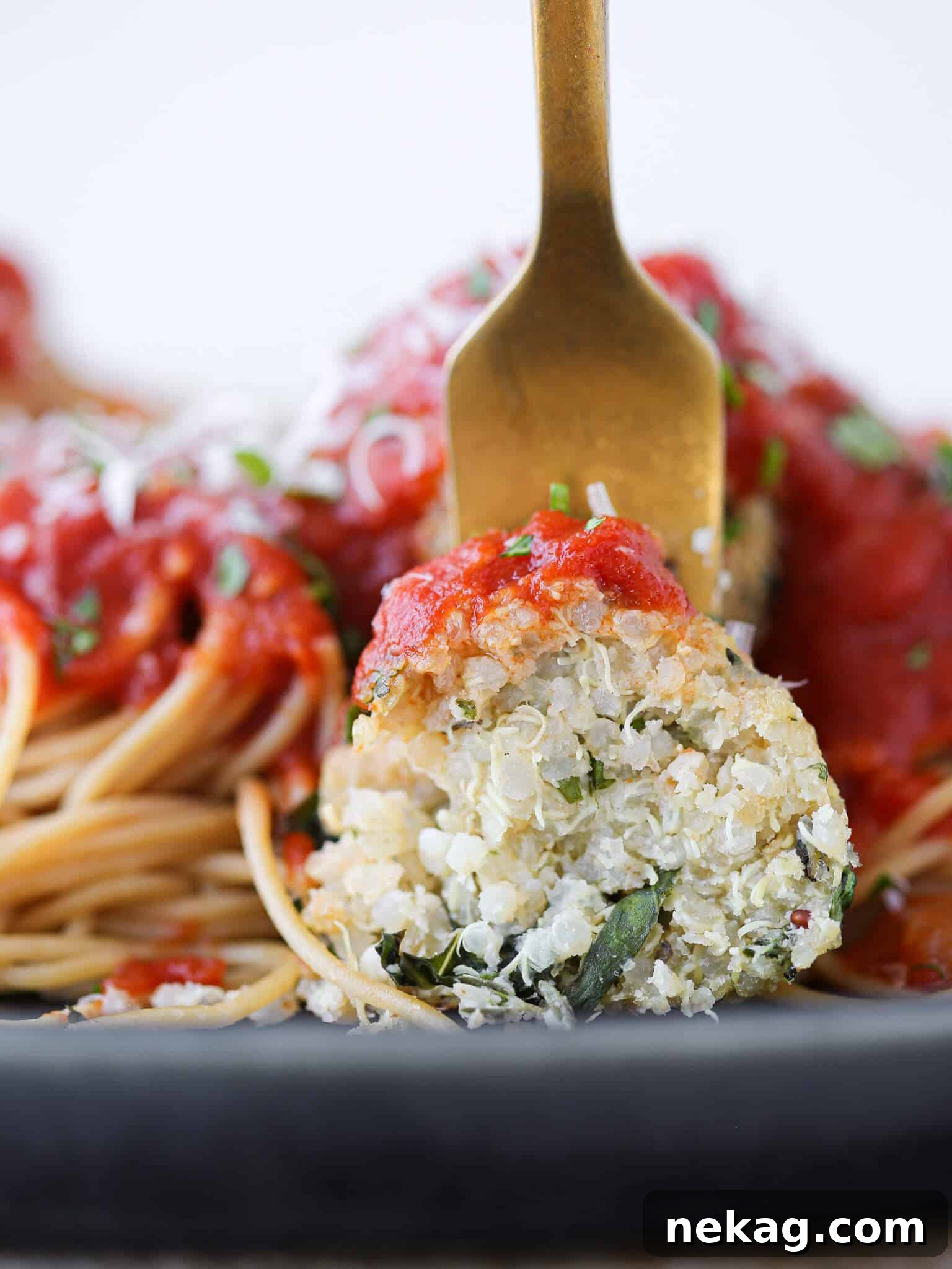Wholesome Quinoa Veggie Meatballs 6 Herbivorous Italian dish sliced open on fork