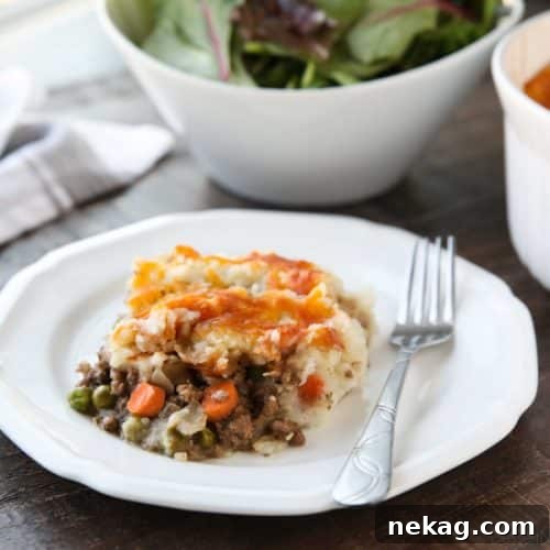 Hearty Lamb and Potato Bake 2 This Shepherd's Pie is a hearty and simple dinner made with ground beef and veggies in a flavorful broth topped with fluffy garlic mashed potatoes and a sprinkle of cheese.
