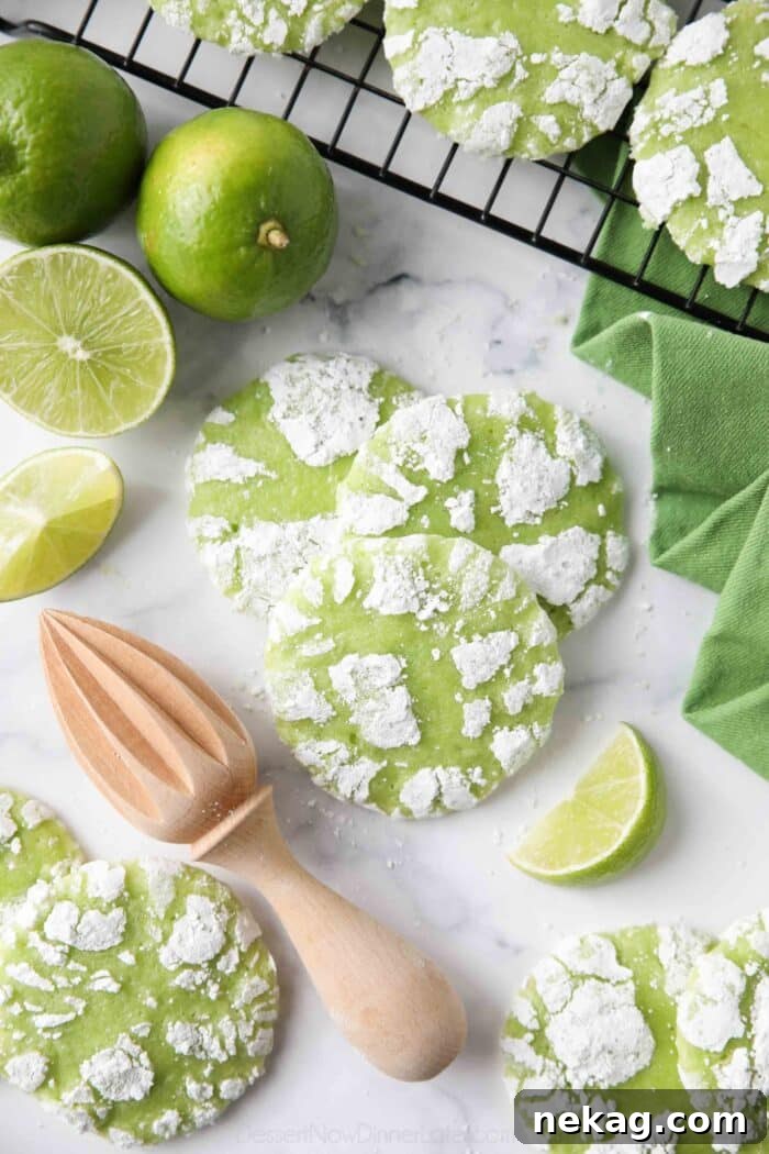 Tangy Lime Crinkle Clouds 3 Crinkle-style lime cookies with powdered sugar.