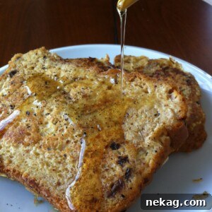 Close-up of freshly cooked Cinnamon Raisin French Toast with maple syrup.