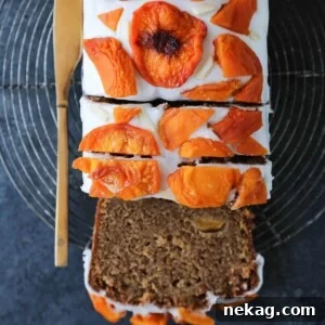Peach Loaf Cake with elegant dried peach decoration, perfect for an overhead shot.