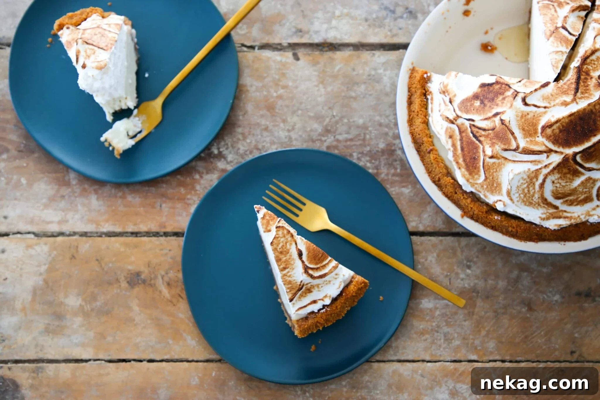 A perfectly sliced key lime pie with a golden crust sits on a rustic wooden surface, highlighting its vibrant color and smooth texture.