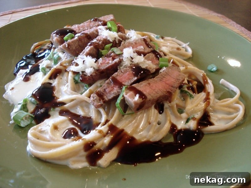 Close-up of elegant Steak & Garlic Parmesan Linguini dish