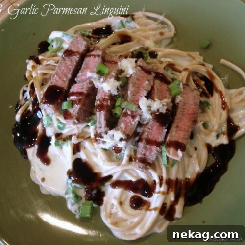 Plated Steak & Garlic Parmesan Linguini with balsamic drizzle