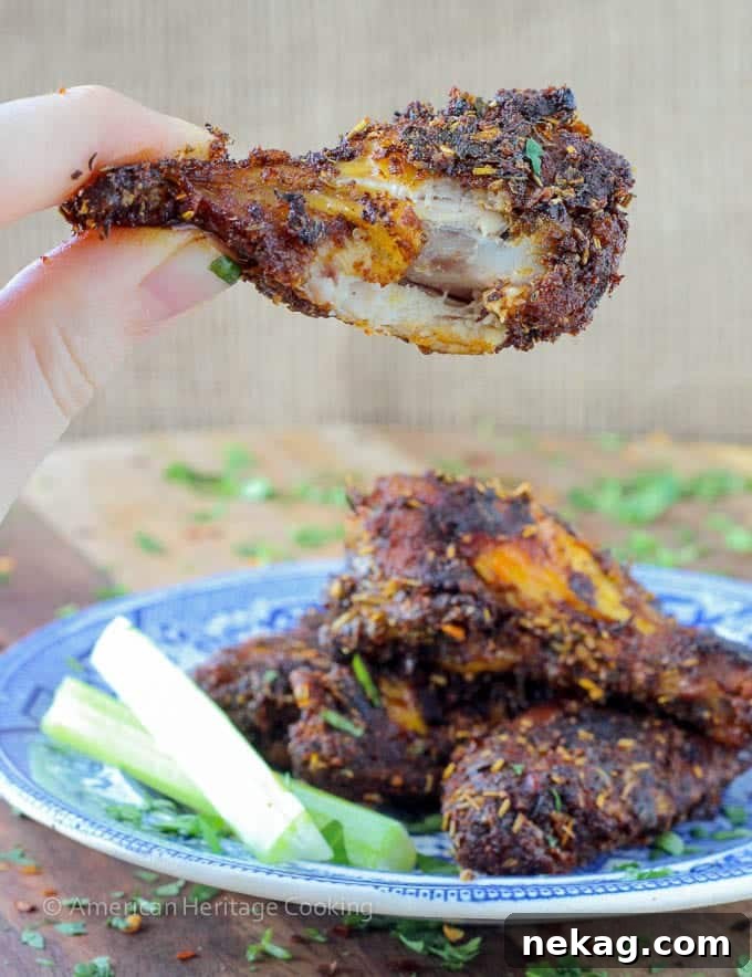 Signature Spiced Oven Baked Wings 3 Spice Rack Dry Rubbed Baked Chicken Wings - Close-up of baked chicken wings on a wire rack